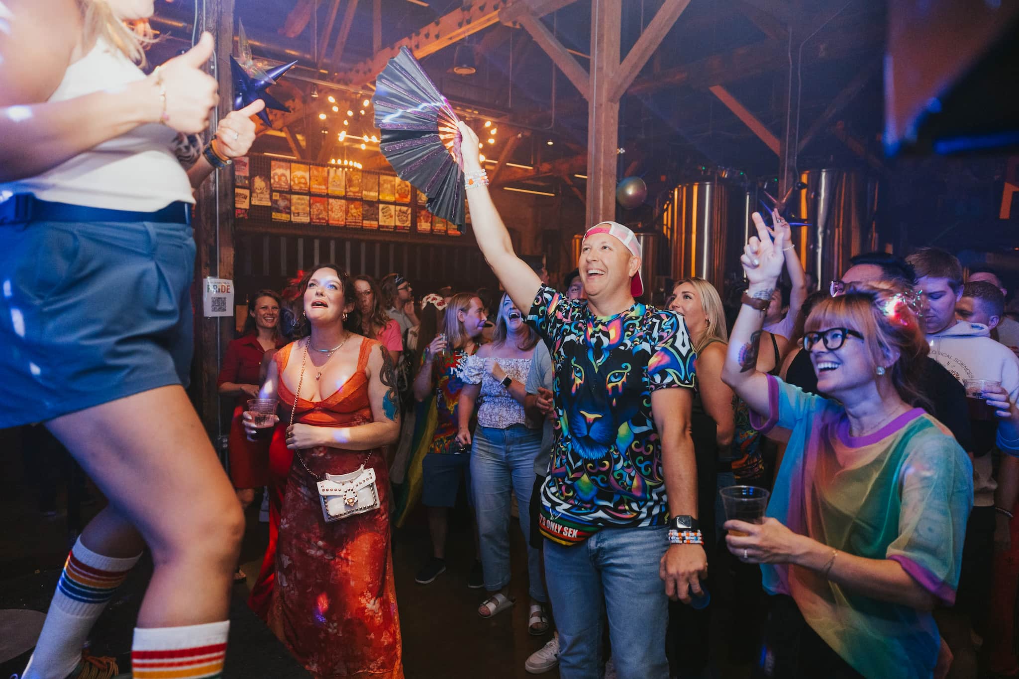 People participating joyfully at a pride event, celebrating love within the pride community.