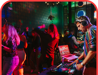 DJ at a pride event, celebrating diversity through music.